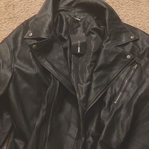 Never worn black faux leather jacket with belt to match